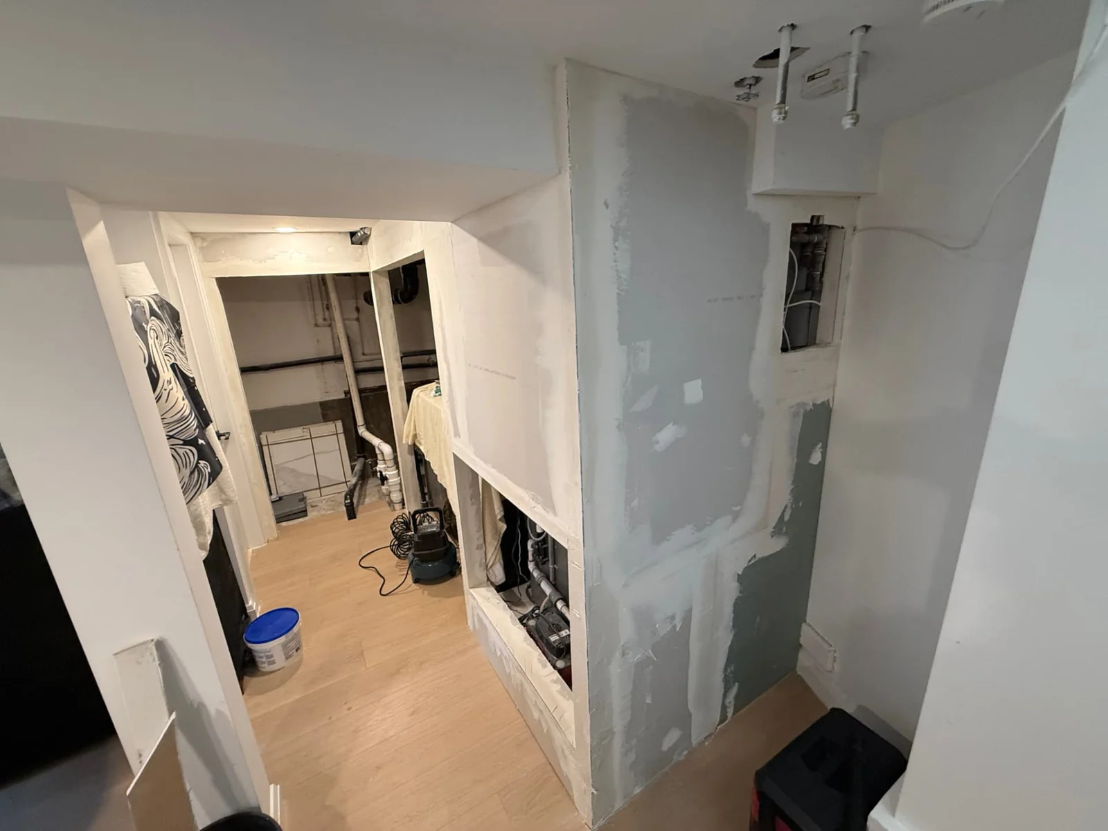 During — drywall installed and joints prepared for a smooth painted finish.