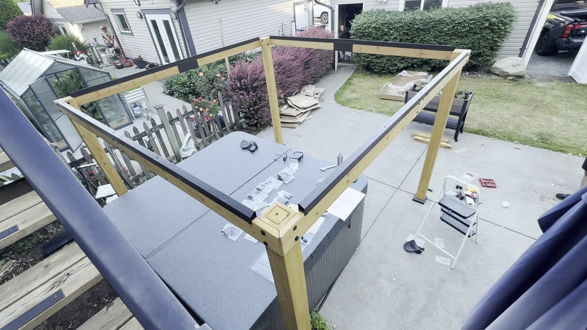 During — posts and perimeter framing taking shape above the deck.