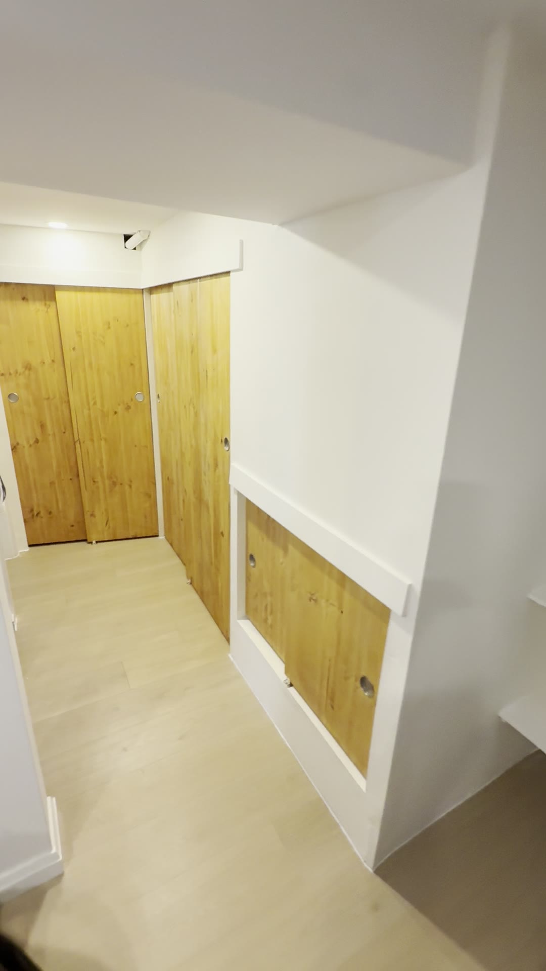 After — final overview of the cleaner, more functional basement space.