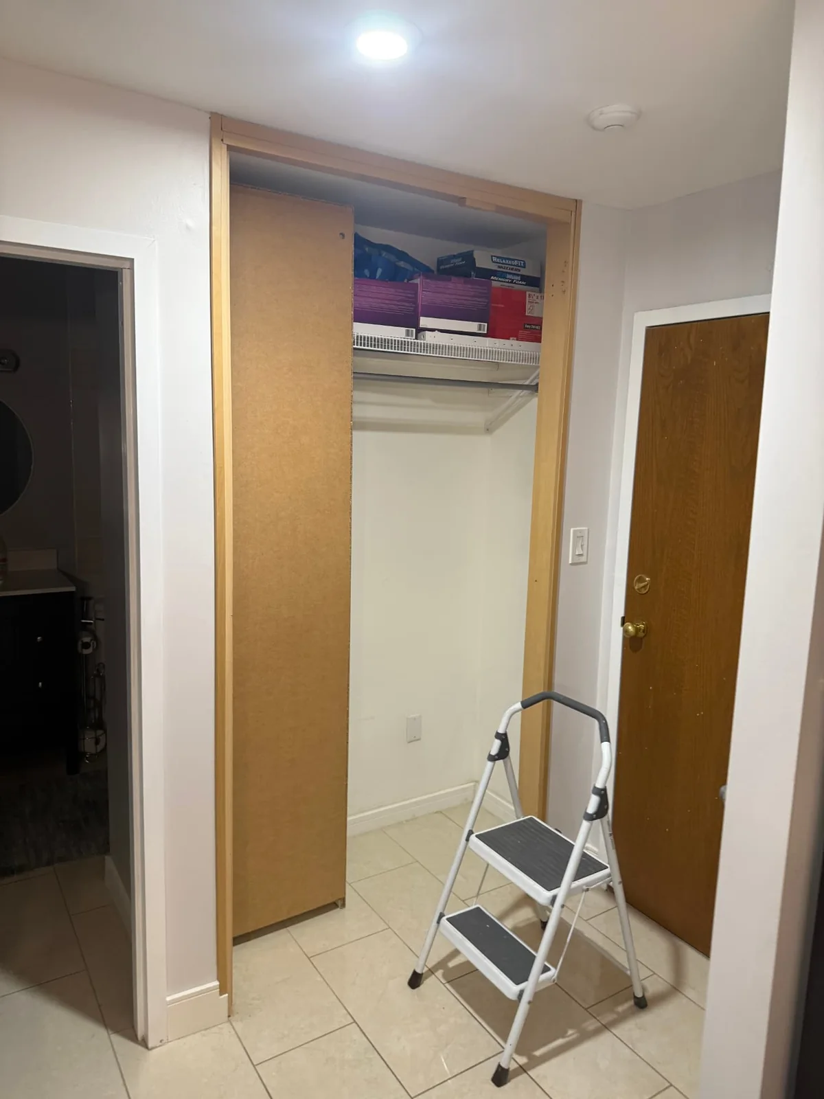 Before — closet opening prepared for remodeling.