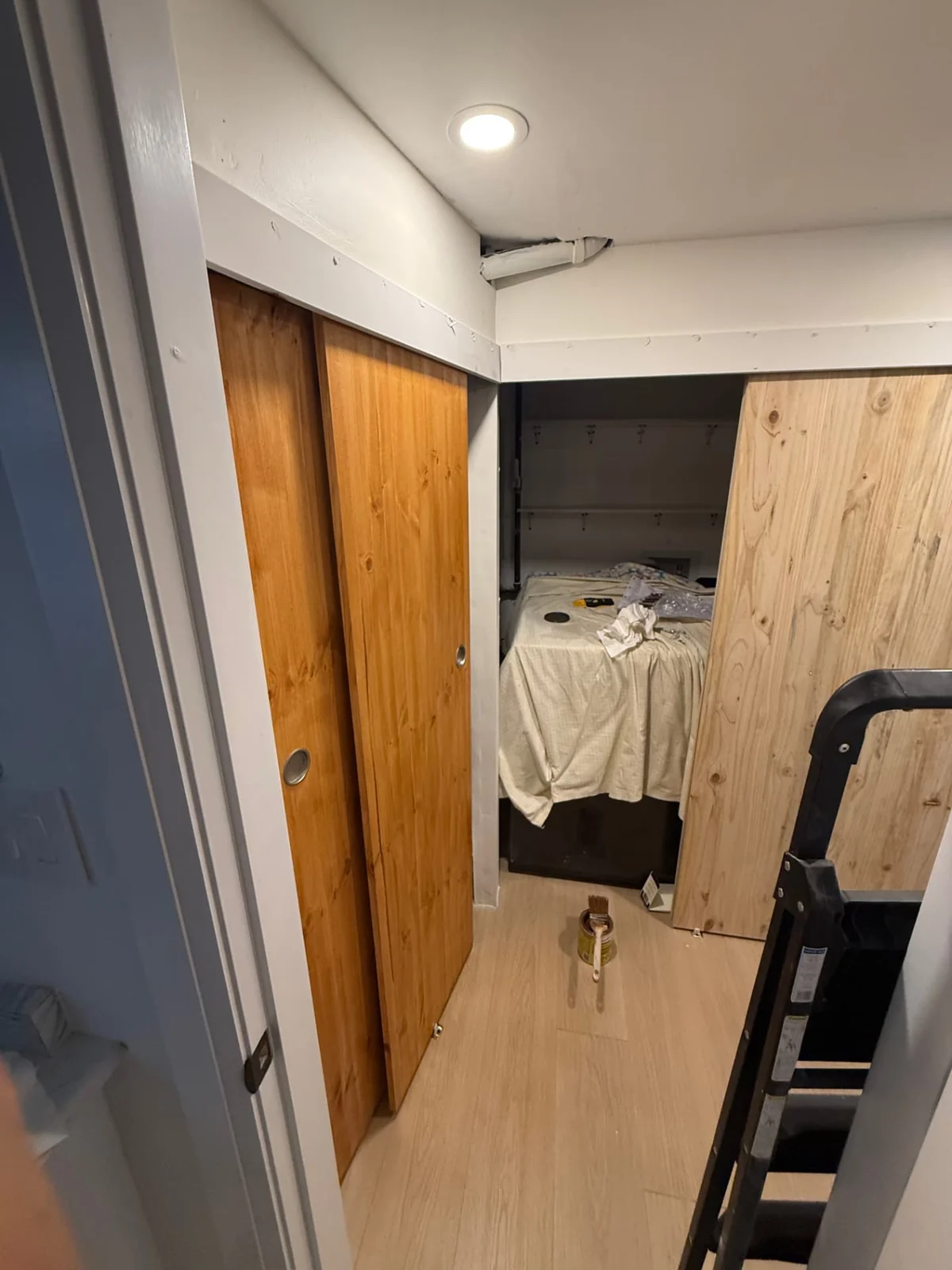 During — custom sliding access doors fitted around the upgraded storage and utility spaces.