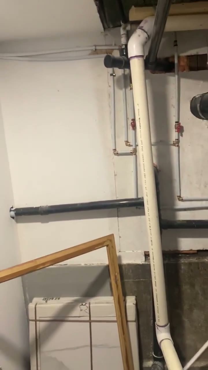 Before — exposed utilities and the original basement area prepared for improvement.