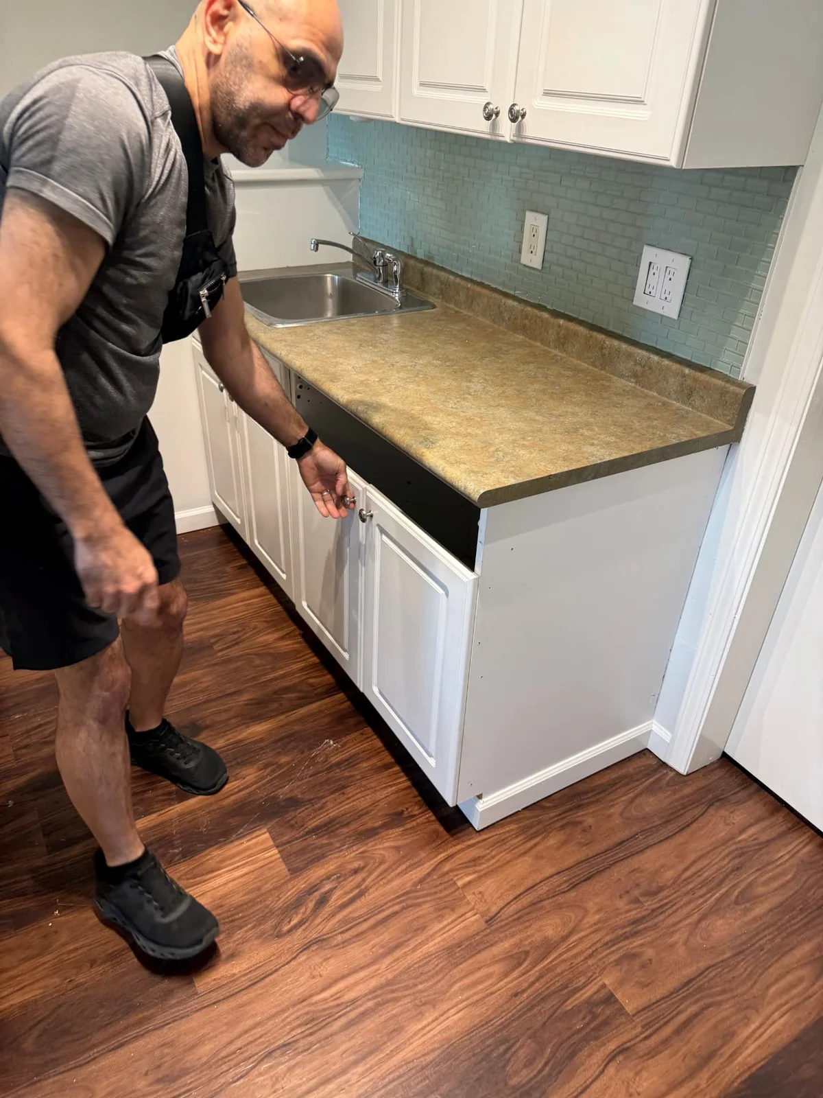 Before — original cabinet configuration and drawer opening.