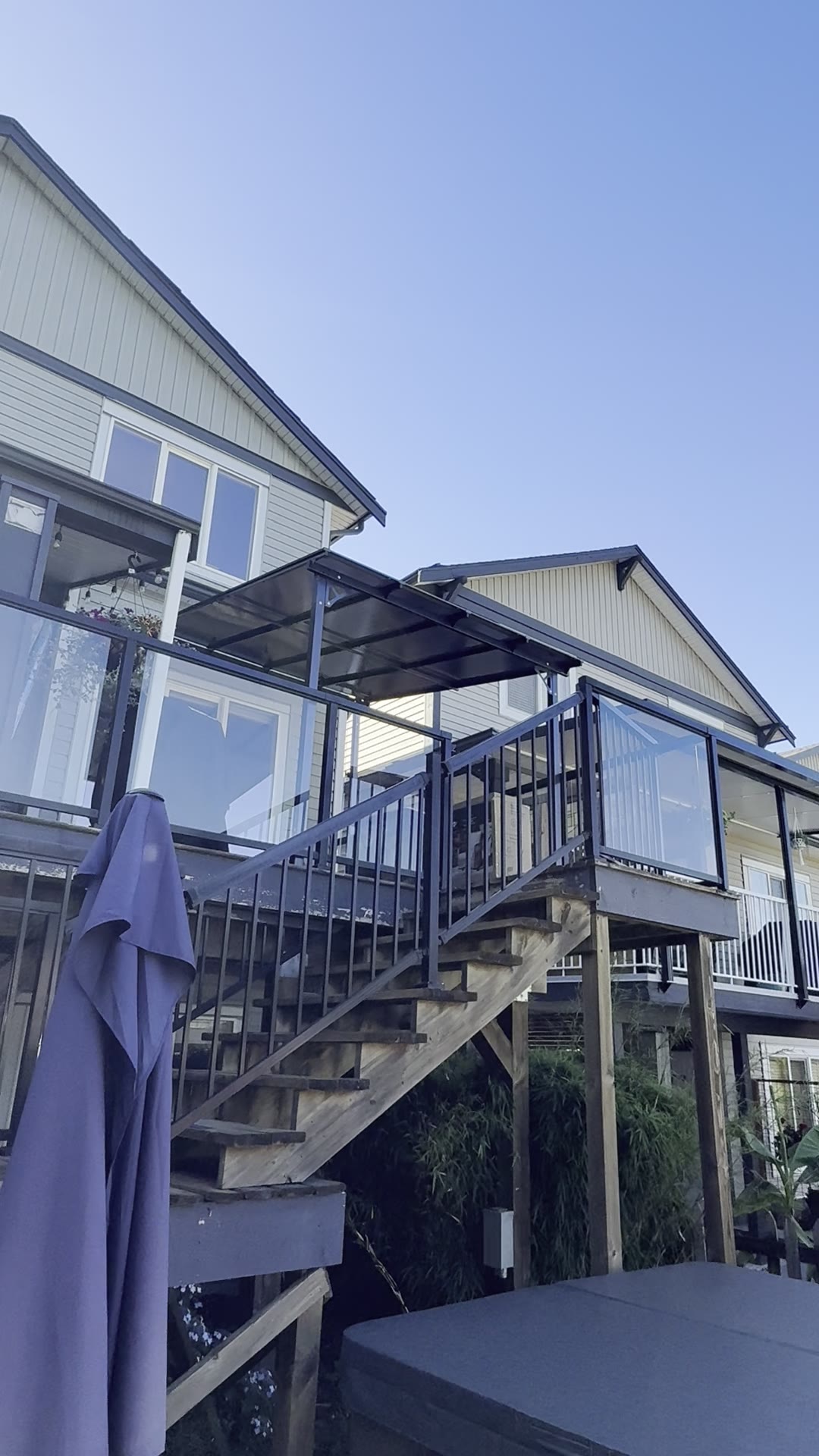 After — completed gazebo and pergola-style deck cover from the yard.