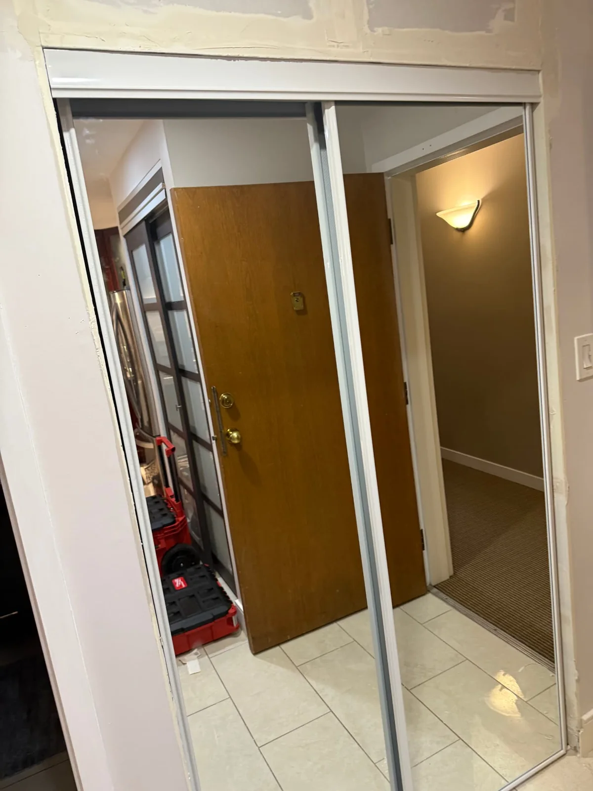 After — mirrored sliding closet doors installed.