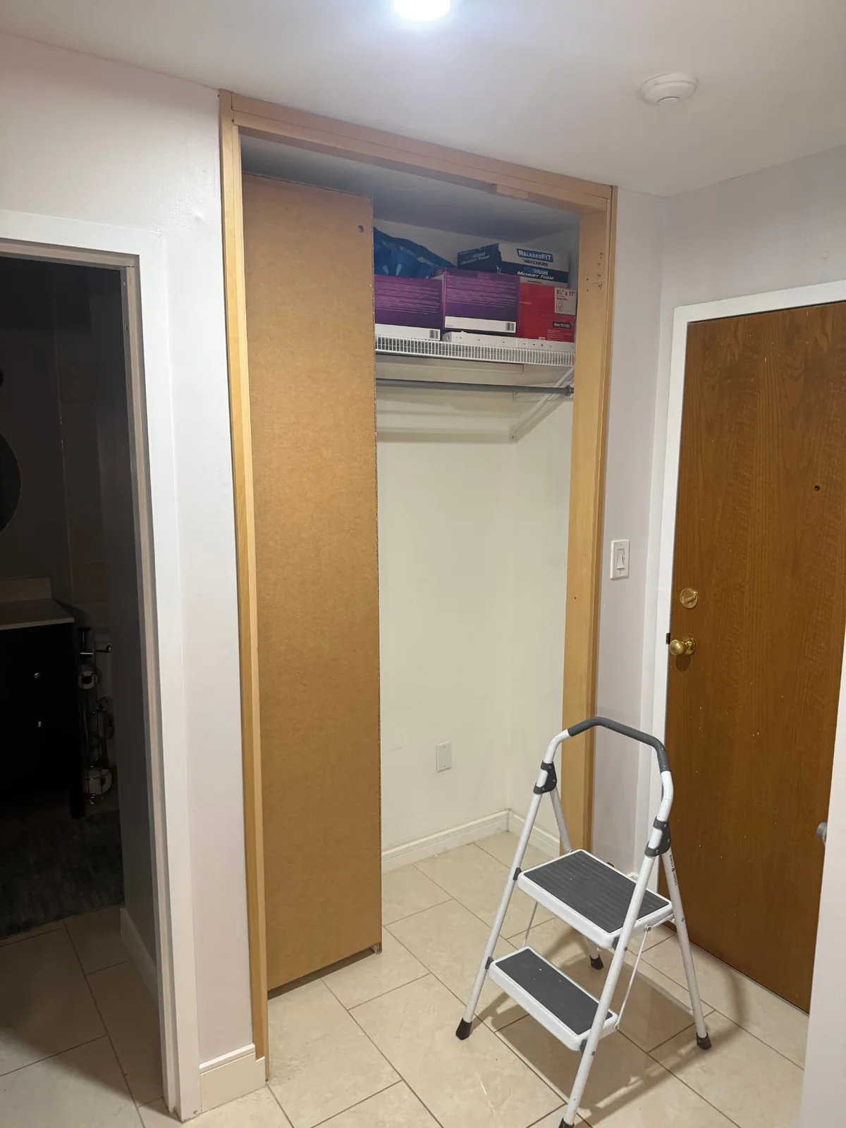 Before — original closet door and trim.